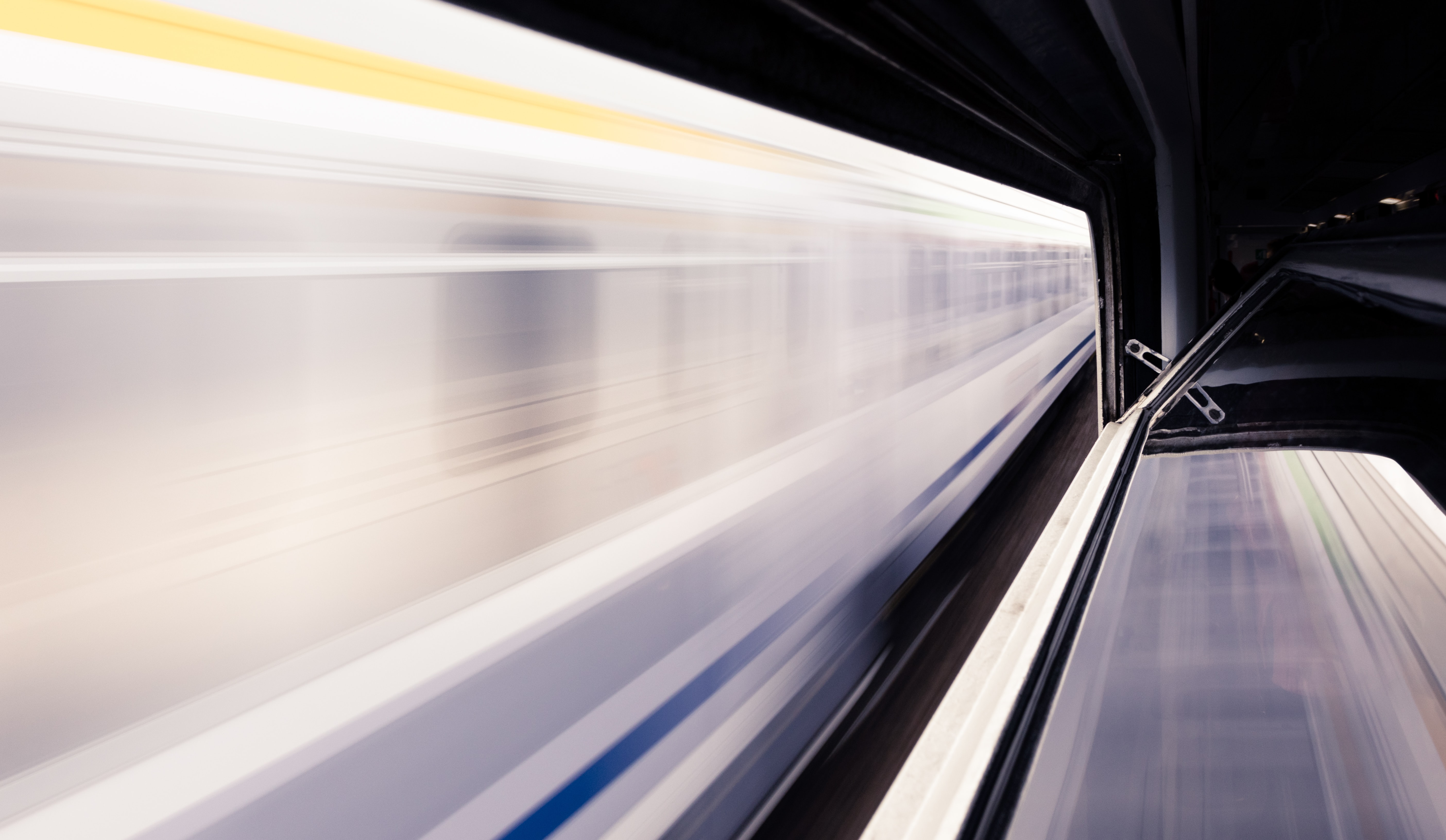 Train passing by station very fast with motion blur